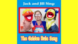 Two puppets and a woman performing The Golden Rule Song.